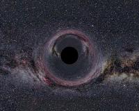 Een computersimulatie van een zwart gat met tien keer de massa van de zon, gezien op 600 km afstand. Hier is duidelijk te zien hoe het licht rondom het zwarte gat wordt afgebogen. / Bron: Ute Kraus, Wikimedia Commons (CC BY-SA-2.5)